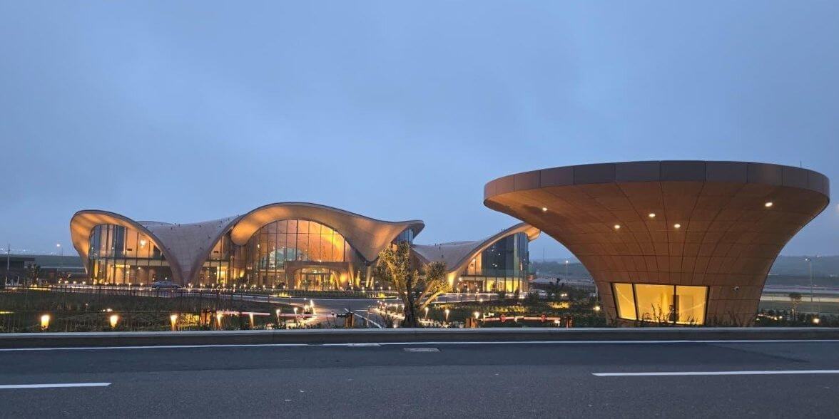 Airporteo greeter holding a name board at the airbridge gate at Istanbul Airport