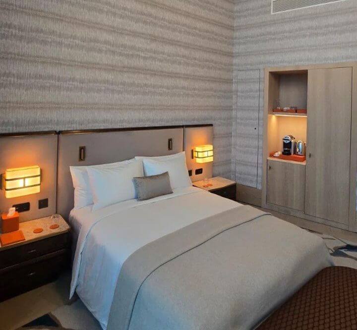 Private suite room inside the VIP terminal at Istanbul Airport with bed, seating area, and private bathroom